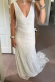 Stunning dress.. def a runner up. If you are 5'7 or shorter, it will need hemming. I assumed it would be pricey to redo the bead work on the hem which was a strong reason for me to go with another dress. Very high quality! - Lacey S.