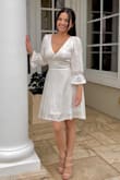 I don't really like the ruffles on my wrists and it does make my hips looks a lot wider bi over all very cute dress - Jenny B.