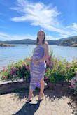 Wore this to my friends wedding 18 weeks pregnant and it was super cute for showing off the bump! I ordered my normal non pregnant size and it was great for a small bump. I'd have to size up further along though! Material was stretchy and comfy! - Ally S.