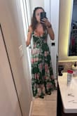 I'm 5'2 and always wear a small. In Lulus I'm an extra small but this dress was built for someone 5'10 or taller which is not the average person. It was also too tight in my boobs. In my pic I'm wearing 4 in heels making me 5'6 and it's still dragging on the ground. - Katie M.