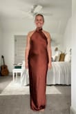 This dress is fabulous. Nice and long for the tall girls. Good thick material. Be aware if you have a small chest/larger bottom. I ordered a large and it fits perfect on my legs/belly but is a little big on my back and near the armpits. Should be easy to pin. - Grace B.