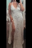 I love it I wish I would have bought a dress like this for my wedding instead of spending so much money on mine. Good quality well made (hella see through) but has a nice body suit under. I wish the straps were adjustable but love it so much. Can't wait to take my anniversary photos in it. - Morgan B.