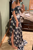 I ordered initially in an XS, but it was a little tight so ordered in a small which fits nicely but the skirt is VERY long. It will hem easily though! Flattering dress! - Elizabeth S.