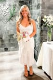I ordered this dress last minute because I could not find one for my bridal shower! I normally wear medium but because it said no stretch I ordered large and honestly it fit great! It wasn't too tight! I probably could've fit in a medium but I like a little wiggle room! Everyone loved it and complimented my dress! It was perfect! - Kelly C.