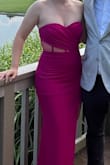 This dress is perfection. It's stretchy and incredibly flattering. I've gained some weight over the past few years and was a little worried about the tightness of the dress when I am a size larger than I usually am but it still looked amazing. I got so many compliments. I didn't even wear shapewear, it actually looked better without it. For some reason I expected the dress to be more pink, but it definitely has purple in it. I've included two pictures to show.
The only two slight comments I have are that it ran a little long (I probably should've gotten it hemmed but didn't have time) and if you wear a bra with it, your bra cup will show through the mesh if you pull the dress up too high.
Anyway, I LOVE this dress. Highly recommend. - Grace O.