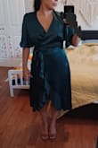 The color, fabric, and style are all gorgeous, however, the zipper in the back didn't make it past my waist. I usually get a size Small, and ordered a Medium and you can see it fits great aside from the fact it doesn't zip up. I do have broader shoulders and upper back, so if you are narrow on the upper half it would likely zip. - Mia A.