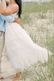 This dress is super pretty but it has sooo many layers & there's a lot of dress so it looks a bit puffy! Looked pretty for beach engagement pics but it made me look huge. - Ashlee W.