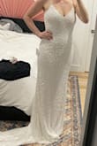 Loved this dress! I thought it might be a little heavy due to all the beading, but it felt totally fine. I do think the straps were a little thin, and if worn for a few hours it would potentially start to dig into my shoulders. I ultimately returned it for two reasons: (1) it doesn't match my venue and is too blingy compared to what my fiancé will wear, and (2) the price. Lulus has so many dresses at lower price points that I couldn't justify this price tag. Still very well made and worth the price though. - Melanie Y.