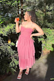 This dress is beautiful and the fabric is to die for. It's light and airy. Perfect for a summer event. I wore it to a wedding and received so many compliments. I'm more on the curvy side so I was scared it would make me look like a box, but it really accentuated my figure. If you're on the busty side you may have issues with spillage in the bustier. - Antwanisha S.