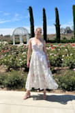 I loved this dress and it was perfect for wearing wine tasting in hot weather! It was a bit loose around the waist so the hem where the zipper comes up to sat a bit low on my lower back. In the photo of the model, the hem line goes straight across, but on me, it sagged down a bit in the middle because it was slightly loose. It was still a great dress! - Haley H.