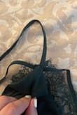 Left bra strap is sewn through the two layers on the bra area. The right side is perfectly fine - kind of stinks because I love everything else about this dress! - Emily D.