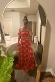 Although it was pretty long for me, once I got it hemmed it was perfect. It's very true to the photos and the little sleeve things are such a cute feminine touch. - Monica O.