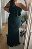 I really wanted to love this dress but it fit a bit weird. The color was beautiful but the right side of the dress was a little too big (the side without the ruffle) and then the side with the zipper wouldn't zip!! It's like the extra inch on the right side needed to be where the zipper was. I would've sized up maybe but it might have looked kind of baggy. - COURTNEY C.