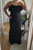 In other dresses on Lulus I fit into a large but this I definitely needed an XL! No stretch, but really pretty dress. - COURTNEY C.