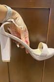 The shoes are beautiful but I needed light tan or nude-colored shoes for my dress and these are more of a soft pink/blush pink color. The ankle strap was a bit loose and I would have to make another hole in the strap to make it fit. Returned these and wore different shoes I bought elsewhere. - Lacey W.