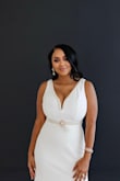 This dress is beautiful.  It's very long so I had to get it shortened and I also added some accent rhinestone pearl trim to the bust area. The dress was paired with a pearl rhinestone belt to match the trim. - Alicia J.