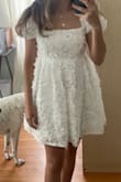 It looks horrible if you're petite/short. Would have to get it hemmed but seems difficult with the flowers. It's really pretty and great quality but I just looked like a balloon. - Alexia G.