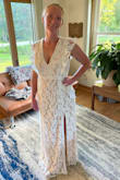 This is my dress! :) I kept being drawn to this dress my whole search, but waited to order because I was worried it was too "plain" for my beach wedding. But the simplicity of this classic style is exactly what made me choose it! I didn't want anything too thick or heavy, so the lack of train is perfect for me! I originally purchased this dress in a large which was a little too big, so I exchanged it for a medium. The fit is just about perfect, I thought about having it altered, but with my wedding just over a month away, I'm opting to just use fabric tape to hold the top in place and have the top lay flat to my chest. The return/exchange process was incredibly easy as well. I originally ordered 3 dresses to "Try at home" and all 3 dresses were stunning and great quality. I received my refund within 2 weeks of my initial purchase. I'm VERY pleased with my purchase and with Lulus in general! Highly, HIGHLY recommend! - Anika P.