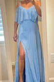 Fits true to size. Easy to zip up without help from another person. The dress is comfortable & loose. Simple yet elegant. - Lisa F.