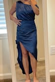 The dress fit true to size, zipped up easily, was comfortable. Nice thick soft satiny fabric. It's unique & sexy. - Lisa F.