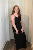 I have not actual wore this dress out of the house yet, but I did try it on. (Just decided to go with a different dress for the specific occasion that night). This dress is great! It's comfortable. It's fitting but somewhat loose so you don't feel confined. I'm definitely looking forward to wearing this dress somewhere one day. The only complaint I have is the chest area does not hold up my chest so I have to wear a bra, which then shows on the side with the skinny strap. I just need to find a clear attachment piece and work with that, but I always prefer a dress that I can work with what I have and not accommodating with "special" help. For people with firm chests that do not droop, thus would be the perfect dress as the material is thick and comfortable for no bra. - Victoria J.