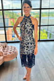A beautiful dress and it fits perfectly. I received lots of compliments. I have small breasts so didn't have to wear a bra. I wore a size XS. I can't wait to wear it again. - Wilmarie S.