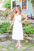 I loved the fit and look of this dress. I wore it to our wedding reception and it was perfect. It has a silver lining to it (which you can't see from the photos). I'm 5'4", 114 pounds, and wore an XS. - Vittoria B.