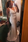 I absolutely love this dress. I got this as my reception dress since my Fiancé wanted something to show off my curves. I am very curvy and I didn't think I would like the mermaid/tight dress style but I love it! I did get a Medium instead of a Large since I am on wedding prep and losing weight currently! I am typically a size 8-10 but the M fit me so well. It has some stretch but not too much! My mother even said she likes this dress better than my wedding dress. - Daisey N.