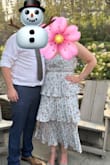 This dress fit great! It has adjustable straps and the dress was flowy; Perfect for a summer wedding! The piece of fabric below the bust looked great if pushed in. I can see how it could have bothered some, but I had no issues with it. - Charlene M.