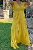 I ordered this for a ranch wedding and got the XL based on reviews and pics posted. I probably could've gotten away with a large because it did bunch up some after it was tied but I'm probably the only one who noticed it. The color and fabric were nice. The top was perfectly adjustable to the amount of skin you'd like to show. I wore it with a pair of small block heels and the length was fine. The quality was decent but it did have quite a few loose threads. I did buy on sale at a great discount so I'm overall happy with the purchase. - Samantha