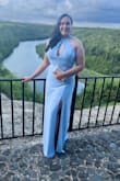 This dress fits me like a glove. It is beautiful and fits in all the right places. Super form fitting and elegant. I got tons of compliments. - Mayreni V.