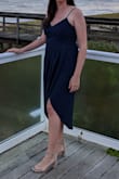 This is such a beautiful dress! I loved the slit although it does come up a bit high when you sit down. The material is light and the color was the perfect navy blue. It did fit a bit tight in the rib area but not so much that it was uncomfortable. The length was perfect on my tall frame and I got many compliments. Overall, a great purchase! - Janelle P.