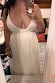 When I tell you my girls were spilling out of this dress. I could barely zip it and was drowning in the length of it. Definitely not super flattering if you're shorter and busty! - Gina S.