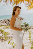 I wore this for my beach wedding - a very last-minute purchase. I tried it on 3 days before the wedding and it was perfect! True to size fit. Why 4 stars: My only qualm is the lack of a zipper. That just makes it annoying to put on and off if you did your hair. - Francesca U.