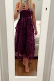 This dress looks amazing in person. So beautiful, the fabric looks nice with the flowers in 3D. I am surprised there are no reviews on this dress. The only thing I would love if this was smaller in size. I ordered Xs and it runs a little loose. - Sabrina L.