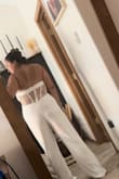 I think it needs some Spanx and I would feel better in it. Ordered for rehearsal dinner but feel like I'd be worried about what my hips/stomach looked like the whole time. Kept for honeymoon dinner outfit. Not a super flattering material, and I really only kept it because I like the back. - Angelica R.