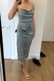 The cowl neckline has weird ruching/pleating on the side, and the neckline is too narrow. Overall, looks really odd. - Isabella P.