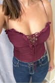 The ruching and lace-up design are cute. Wrong color and it's too small. This isn't burgundy, it's wine purple. The straps are too tight. I would need medium if I'm keeping [it]. Still deciding. - Heather R.
