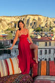 I wanted a red flowy dress for some pictures, and -having bought several dressy Lulus red outfits in the past- I got this one. The dress is beautiful, well made, great quality, and fits well, but it is not really red, it is more like a dark strawberry or burgundy. It does look red in some pictures in the sunlight, but just be aware. I am usually between sizes S and M and based on the reviews, I went for the S. Worked perfectly. Wore a bridal bustier under it and did the job. Long dress (I am 5'6"), drags quite a bit on the floor, but still wore it to dinner without alterations. - Ana P.
