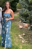 Beautiful fabric, well constructed and got a ton of compliments both at the wedding and on social media after! Someone asked me if I had it tailored because it fit like a glove. Just had to hem it a bit but the lace up detail makes it so easy for it to fit well. The slit is pretty high though when you sit but it's definitely manageable. Can't wait to wear it again! - Kacey P.