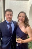 I am 5'2", 130lbs, and bought a size small. I wore this to a June wedding. It was a tad tight on me but I kept it anyway. The material was nice and soft. When I sat down the bottom slit/wrap part would expose most of my thigh, and the fashion tape wasn't holding it together very well. I had to adjust it a decent amount. Otherwise, it was a very cute, flattering, and comfortable dress! - Holly H.
