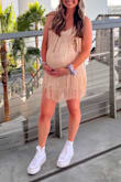 I wore this dress in the champagne color for Taylors Eras tour and received so many compliments! I sized up to a large because I was about 6 months pregnant and it worked! Like others noted it's veryyyyy short. The fringe helped to make the short length less noticeable, but I wish the dress itself was a couple inches longer, especially in the back! - Kellie N.