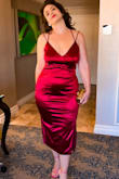 Ok, this dress, especially for the sale price, is a dream! I almost purchased the Large but it would have been too tight in the hips. My hips are 42-43 inches. The dress feels silky and is fully lined. I have never felt this sexy in a dress! I'm a full C-cup and would have been even more spectacular if I was a D-cup. I still feel as though they fill out the top well enough and there is no feeling of boob slippage at all. I threw on some light, short shapewear under it because it will show bumps and cellulite even though the fabric is a decent thickness. I will be wearing this in Vegas for a dinner date with my hubby. - Sarah S.