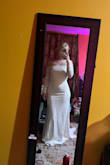 The dress is good quality, thick material, and the mesh is stretchy and soft. The dress is very comfortable and stretches around curves. It's long but I don't mind since I still need to get my heels. - Gloria S.