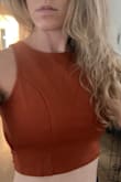 I normally order XS from Lulus and that either fits or is a little big. This shirt runs small, is super tight under the arms, and is very cropped. Size up! Otherwise very cute. - Elsa F.