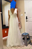 Very pretty bright white and delicate tulle create a great contrast together. I was not a fan of the tail but it was very comfortable and light. - Nicole A.