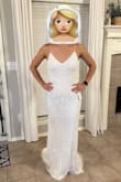 This dress was beautiful and fit very well. The beading was a little heavy. Amazing dress. - Ashley A.