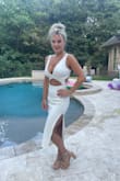 Fits true to size, has some stretch, and is very comfortable. Love this dress! - Cortnee R.