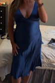 This dress is beautiful! The silhouette is perfect. Looser in the midsection/hips so it's flattering if you have a little bit of a tummy. It is tight in the bust/shoulders (for a larger chest) and the arm holes are small, but it still works. Can't wait to wear it to an upcoming summer wedding! - Liz H.