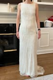 I love this dress! It is a very elegant option as a wedding dress, fit me great, and was comfortable. I would recommend wearing nude underwear as it is a tad see-through in bright light. I ended up going with a different wedding dress but really enjoyed the way I looked in this one. It shows all curves (or lack of in my case, which didn't bother me). The beading is beautiful. - Patricia R.